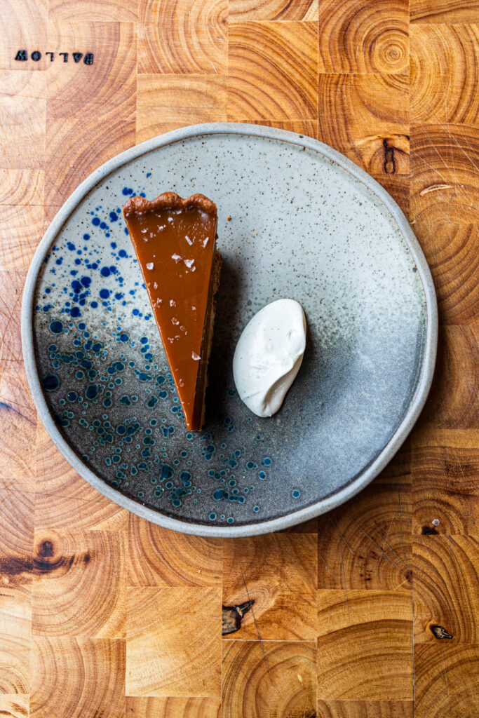 An over head image of a Gypsy Tart next to a rocher scoop of crème fraîche