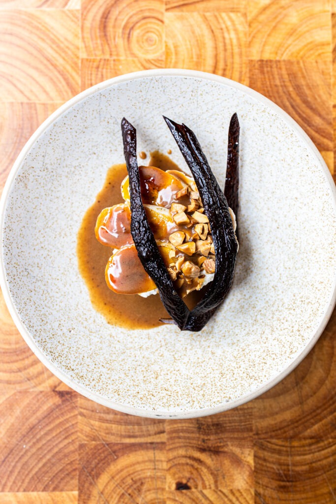 An overhead shot of a banana parfait and topped with fried banana skins.